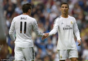 The Portuguese superstar wipes some ectoplasm on Bale's palm for good luck.